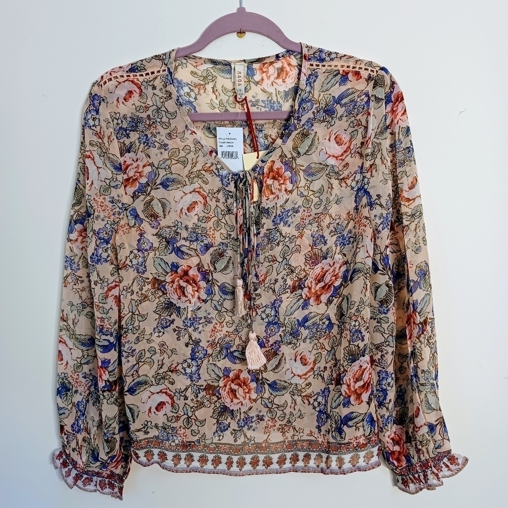 RAGA Victoria Tassel neck blouse in peach. NWT